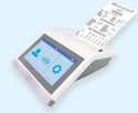 Alpha Spirometer with integrated thermal printer, shown printing a spirometry report.
