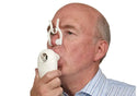 Elderly man with nose clip on, breathing into the COPD Screener.