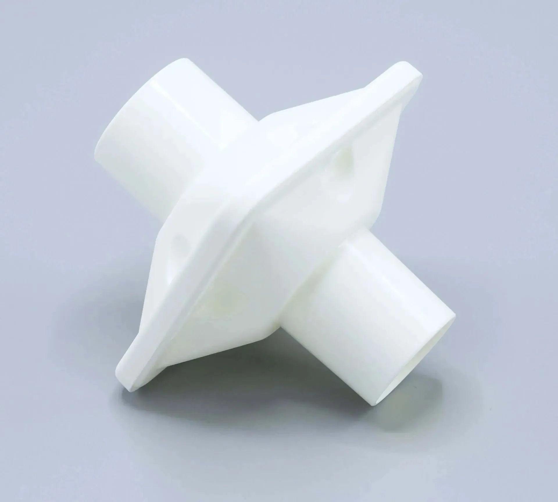 The bacterial/viral filter mouthpiece shown is round in shape, and white in color..