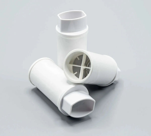 Three Disposable Inhaler (MDI) SafeTway are shown from different angles.  They are white, one-way mouthpieces.