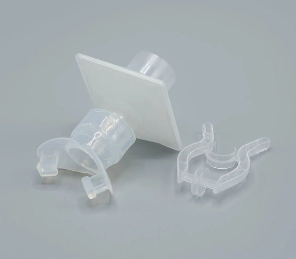 The components of the Eco Lab Spiro Bacterial/Viral Filter kit are white translucent in color.  Along with the filter, an elliptical mouthpiece with a clear silicone front bite and an all-plastic eco-disposable nose clip are shown.