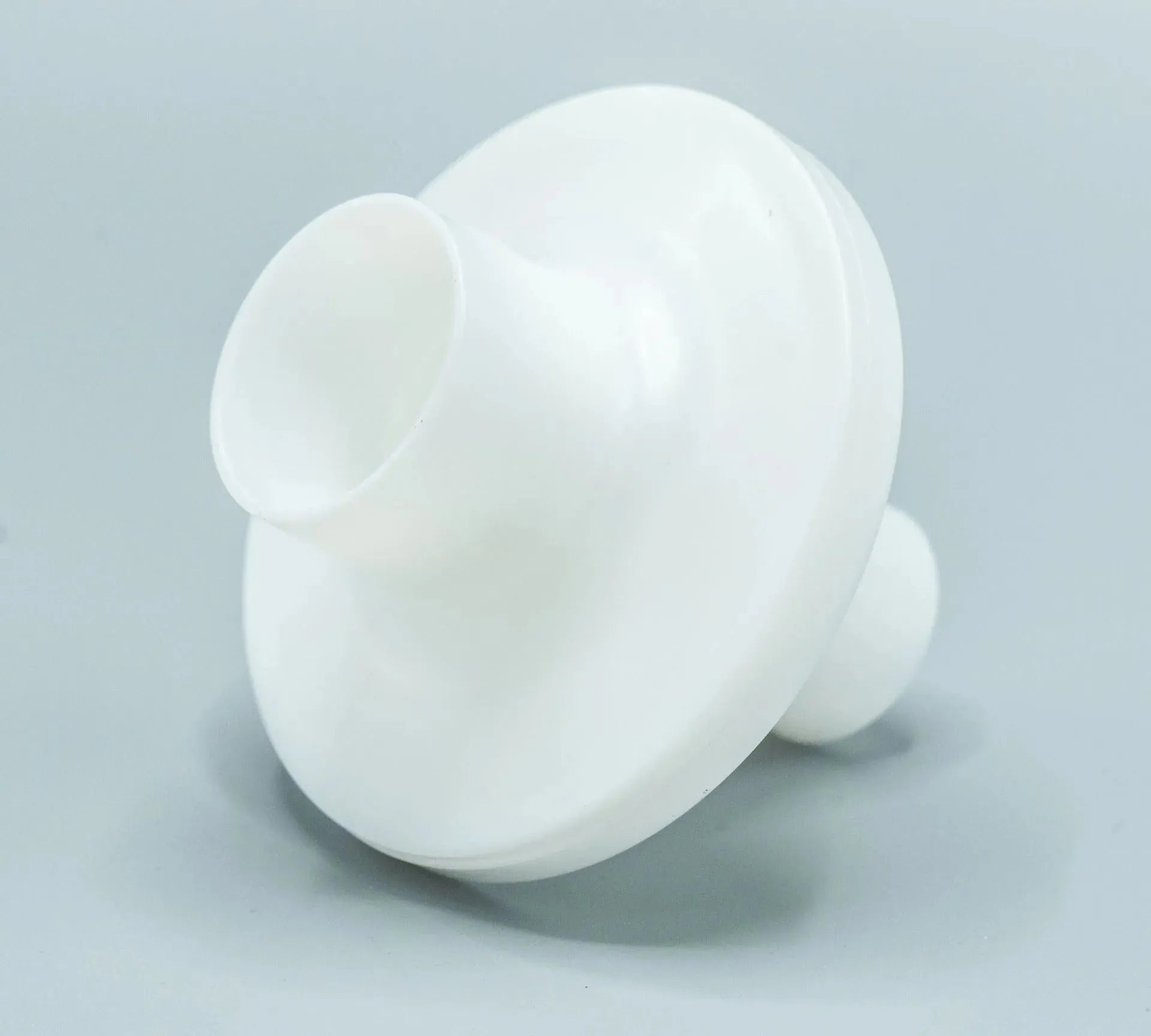 The Spirometry Bacterial Filter shown is round in shape and white in color, although other colors are available for this filter.