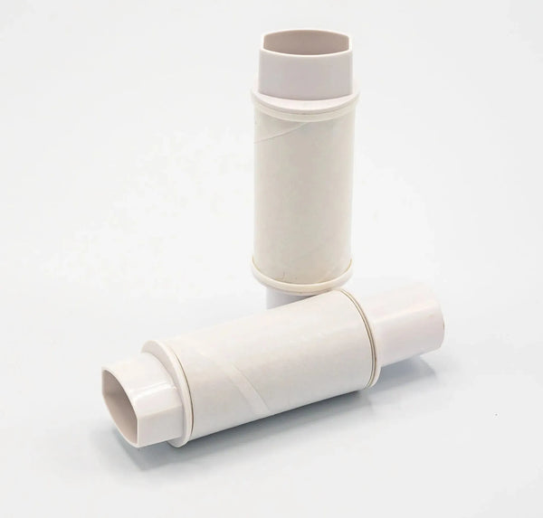Two white disposable one-way pediatric mouthpieces.